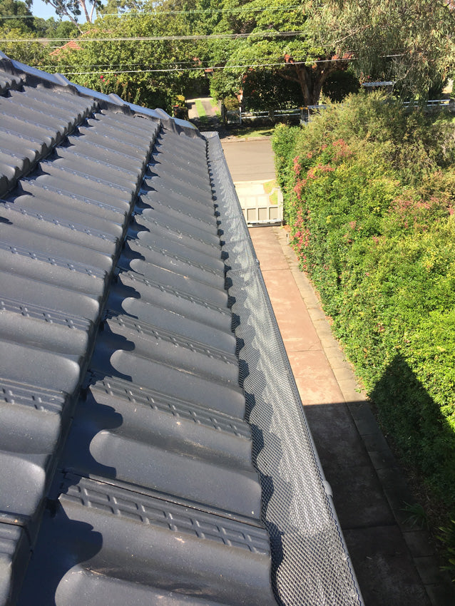 installed gutter guard to concrete tiled roof